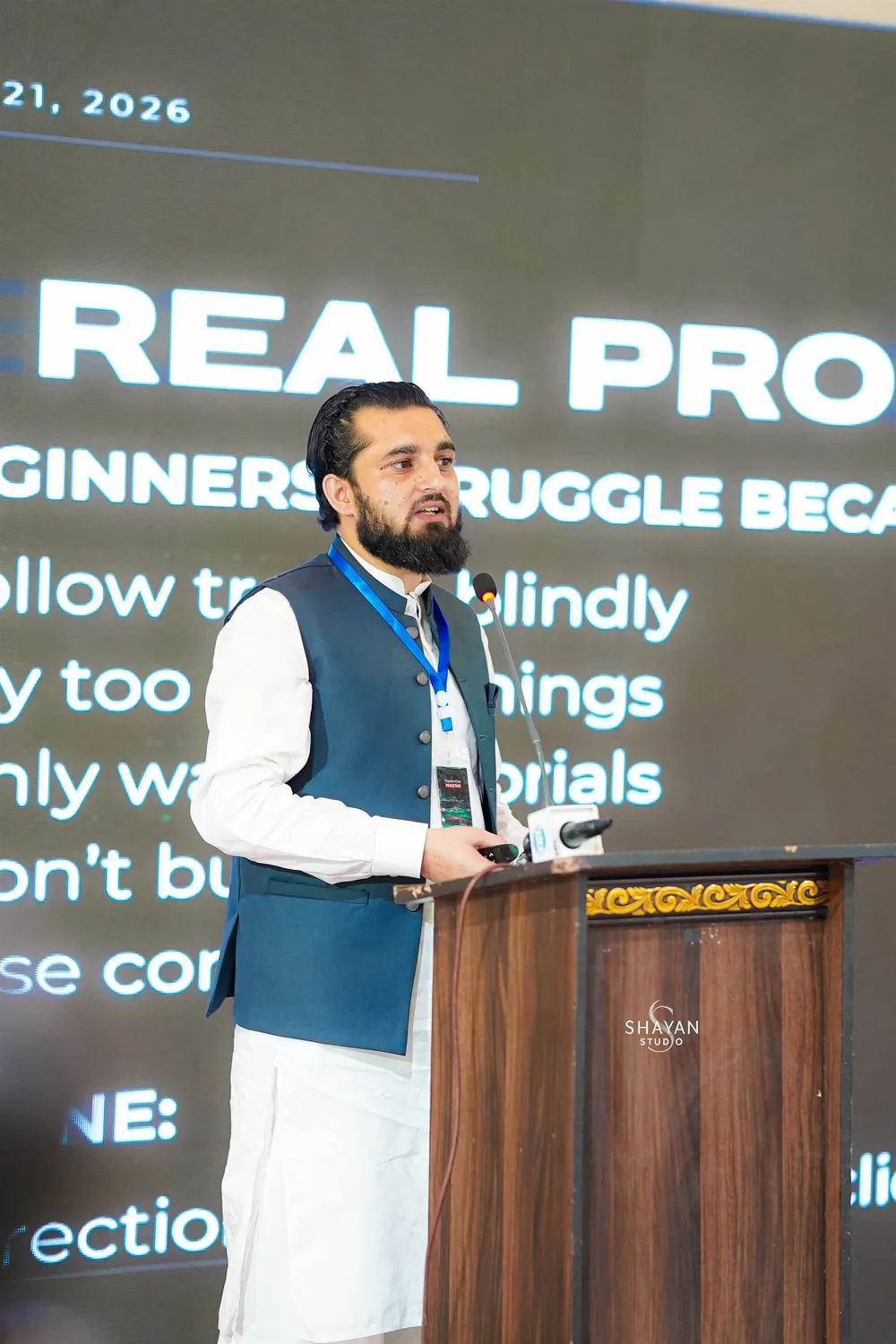 Umair speaking at a tech event